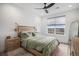 Light and airy bedroom featuring a large window, neutral decor, and comfortable furnishings at 3564 Doubletrack Ln, Castle Rock, CO 80108