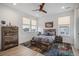 This rustic bedroom offers a bed, dresser, and 2 windows, and a decorative rug, with room to relax at 3564 Doubletrack Ln, Castle Rock, CO 80108