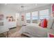 Bright bedroom with a large window and a neutral palette, offering a serene and inviting space at 3564 Doubletrack Ln, Castle Rock, CO 80108