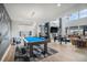 Spacious game room with a pool table, fireplace, and comfortable seating, perfect for entertainment at 3564 Doubletrack Ln, Castle Rock, CO 80108