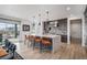 Modern kitchen features a large center island with seating, pendant lighting, and stainless steel appliances at 3564 Doubletrack Ln, Castle Rock, CO 80108