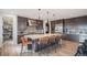 Modern kitchen with a large center island with barstool seating, stainless steel appliances, and stylish cabinetry at 3564 Doubletrack Ln, Castle Rock, CO 80108
