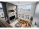 Upper view of stunning living room with high ceilings, fireplace, large windows and stylish furniture at 3564 Doubletrack Ln, Castle Rock, CO 80108