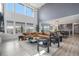 Bright and airy living room featuring high ceilings, large windows, and an open floor plan at 3564 Doubletrack Ln, Castle Rock, CO 80108