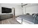 Bedroom with a walk-in closet and a sleek dresser, creating a comfortable and organized retreat at 3564 Doubletrack Ln, Castle Rock, CO 80108
