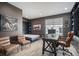 Home office with a built-in Murphy bed, sleek desk, and comfortable seating, ideal for work or relaxation at 3564 Doubletrack Ln, Castle Rock, CO 80108