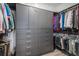 Organized walk-in closet with custom shelving, drawers, and ample hanging space for clothes and accessories at 3564 Doubletrack Ln, Castle Rock, CO 80108