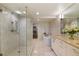 Modern bathroom with a glass-enclosed shower, soaking tub, and marble tile at 1020 15Th St # 42A, Denver, CO 80202