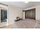 Bright bedroom with hardwood floors, closet and a view to bathroom with glass shower at 1020 15Th St # 42A, Denver, CO 80202