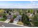 Overhead shot showcasing a beautiful home with mature trees, well-kept lawns, and a serene neighborhood setting at 1792 W Kettle Ave, Littleton, CO 80120