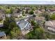 Beautiful home nestled amongst mature trees in a quiet neighborhood with lush green landscaping at 1792 W Kettle Ave, Littleton, CO 80120