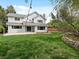 Spacious backyard with a lush lawn, landscaped garden beds, and a charming patio area perfect for outdoor enjoyment at 1792 W Kettle Ave, Littleton, CO 80120