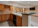 Basement with a wet bar, tile backsplash, bar seating, and stairs to the main level at 1792 W Kettle Ave, Littleton, CO 80120