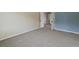 Spacious carpeted bedroom with large doorway entrance and neutral color scheme at 1792 W Kettle Ave, Littleton, CO 80120