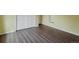 Bedroom with a double door closet and light-colored wood-look floors at 1792 W Kettle Ave, Littleton, CO 80120