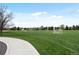 Open, green field with soccer nets and walking path; great for outdoor activities at 1792 W Kettle Ave, Littleton, CO 80120
