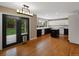 Well-lit kitchen with hardwood floors, dual-toned cabinets, and backyard access at 1792 W Kettle Ave, Littleton, CO 80120