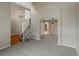 Inviting living space with arched doorway, neutral walls, and plush carpeting at 1792 W Kettle Ave, Littleton, CO 80120