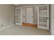 Sunlit office features plush carpet and glass paneled French doors to let natural light in at 1792 W Kettle Ave, Littleton, CO 80120