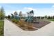 View of a new, modern playground with slides, climbing nets, and other play equipment at 1792 W Kettle Ave, Littleton, CO 80120