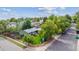 This aerial view shows a home with a fenced yard, landscaping, and mature trees at 5007 S Richfield Cir, Aurora, CO 80015
