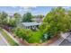 Aerial shot of a well-maintained home with a fenced yard and mature trees at 5007 S Richfield Cir, Aurora, CO 80015