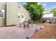 Exterior of home featuring patio, green siding, yard and seating for outdoor enjoyment at 5007 S Richfield Cir, Aurora, CO 80015