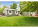 Lovely single-story home with a lush green lawn and beautiful landscaping at 5007 S Richfield Cir, Aurora, CO 80015