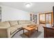 Inviting living room with a comfortable sectional sofa and a built-in bookcase at 5007 S Richfield Cir, Aurora, CO 80015