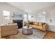 Comfortable living room features a fireplace, hardwood floors, and modern decor at 5007 S Richfield Cir, Aurora, CO 80015
