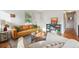 Cozy living room with a plush sofa, hardwood floors, and natural light at 5007 S Richfield Cir, Aurora, CO 80015