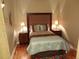 Comfortable bedroom with stylish headboard, side tables, and warm lighting at 1441 Central St # 211, Denver, CO 80211