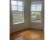 Sun-filled bedroom with hardwood floors and views to the cityscape at 1441 Central St # 211, Denver, CO 80211