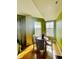 Bright dining area with a round table set and views from two windows at 1441 Central St # 211, Denver, CO 80211