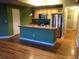 Open kitchen with breakfast bar, stainless steel appliances, and ample cabinetry at 1441 Central St # 211, Denver, CO 80211