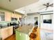 Modern kitchen featuring stainless appliances, granite counters, and a breakfast bar at 1441 Central St # 211, Denver, CO 80211