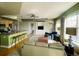 Spacious living room with a comfortable seating arrangement and kitchen views at 1441 Central St # 211, Denver, CO 80211