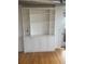 Built-in bookshelves and cabinetry with views to the private balcony at 1441 Central St # 211, Denver, CO 80211