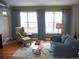 Comfortable living room with a full seating arrangement and views to the outdoors at 1441 Central St # 211, Denver, CO 80211