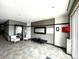 Modern lobby area featuring neutral tones, tile floor and waiting area with chairs and benches at 1441 Central St # 211, Denver, CO 80211