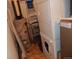 Small utility room featuring a washing machine, dryer and water heater at 1441 Central St # 211, Denver, CO 80211