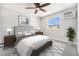 Comfortable bedroom featuring neutral tones, carpet, ceiling fan, and natural light at 155 S Pennsylvania St # 308, Denver, CO 80209