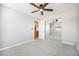 Bedroom with carpet flooring, a ceiling fan, and large mirrored closet doors at 155 S Pennsylvania St # 308, Denver, CO 80209