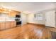 Kitchen with stainless steel appliances, light wood cabinets, and hardwood floors at 155 S Pennsylvania St # 308, Denver, CO 80209