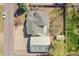 Aerial view of a home with a well-maintained roof, spacious driveway, and landscaped backyard at 8167 S Dover St, Littleton, CO 80128