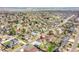Aerial view of a home in a neighborhood near a body of water with mature trees at 8167 S Dover St, Littleton, CO 80128