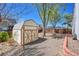 Backyard features a storage shed and rock landscaping, perfect for outdoor activities at 8167 S Dover St, Littleton, CO 80128