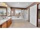 Bright bathroom featuring a soaking tub, glass shower, double vanity, and ample natural light at 8167 S Dover St, Littleton, CO 80128