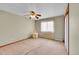 Bright bedroom features a ceiling fan and a window that lets in natural light at 8167 S Dover St, Littleton, CO 80128