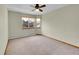 The bedroom has carpet and natural light at 8167 S Dover St, Littleton, CO 80128